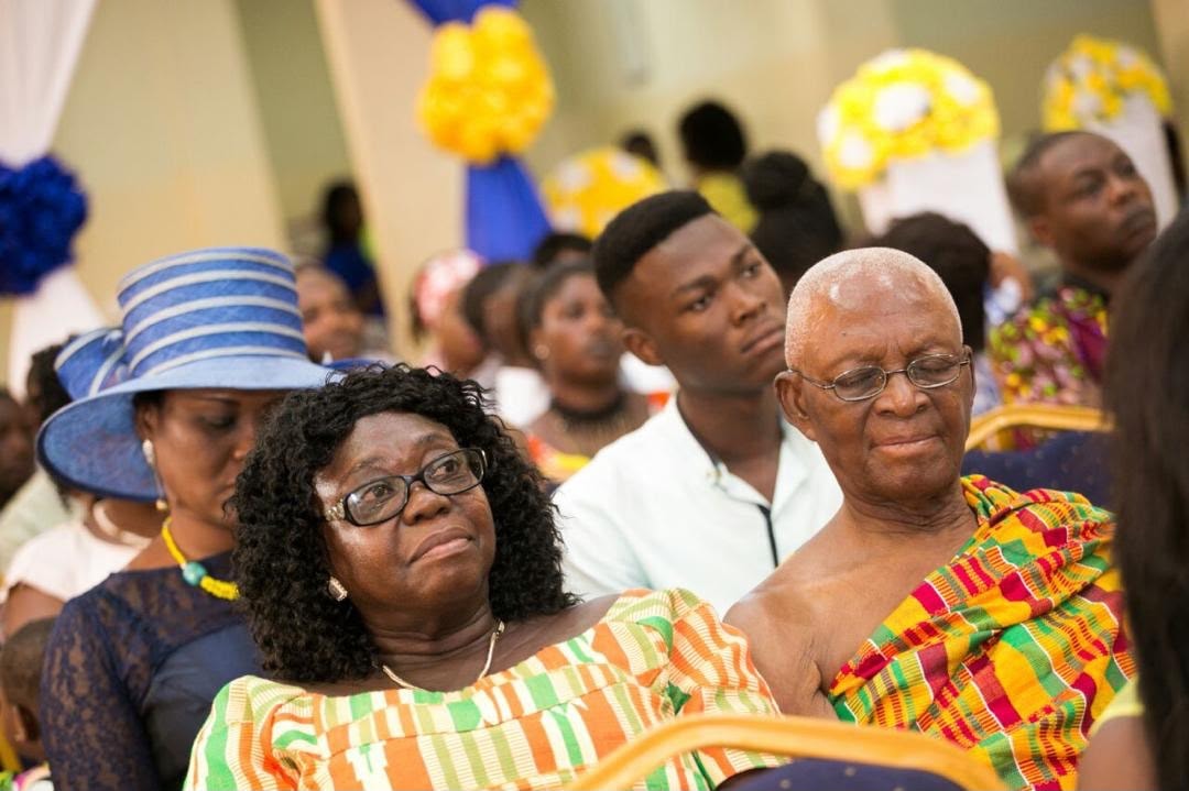 Captain side by side his beloved wife, Surrounded by family